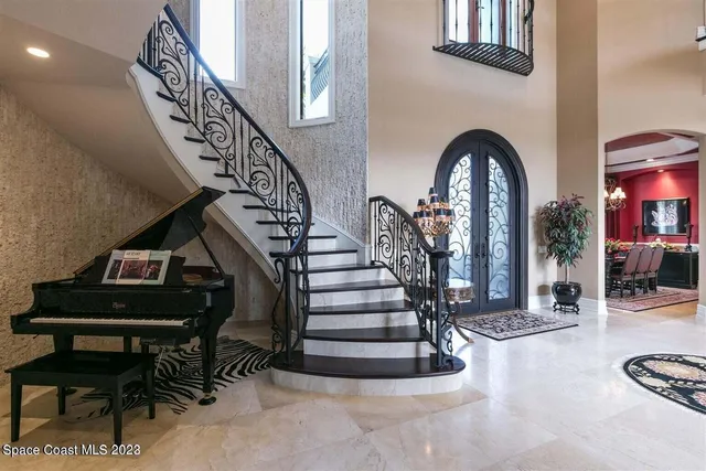 a living room with furniture a rug and a window