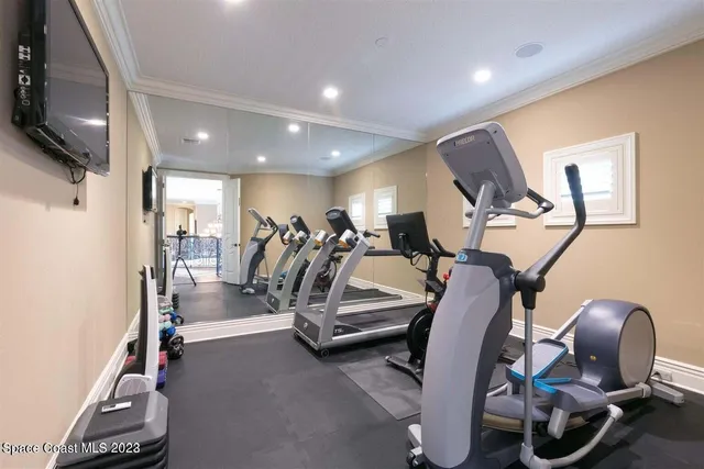 a bathroom with a granite countertop sink a toilet a mirror and shower