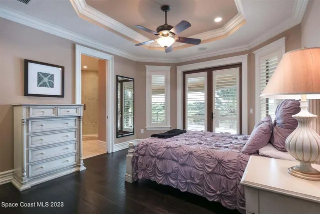 a bathroom with a granite countertop toilet sink and mirror