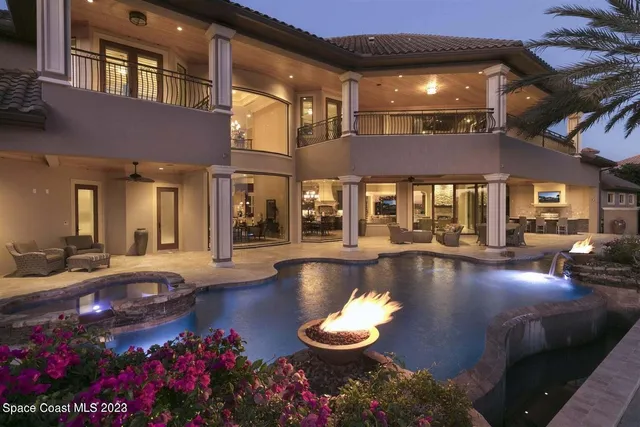 a front view of house with yard and outdoor seating