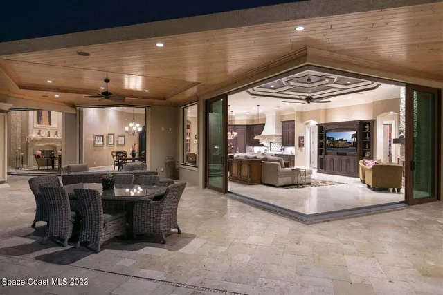 a view of a lobby with furniture and chandelier