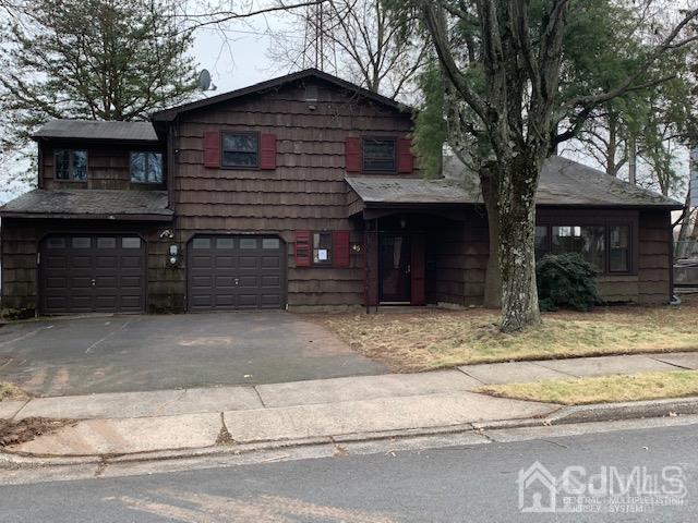 45 Meyer Road Edison, NJ 08817 - Photo 1 of 11 a front view of a house with a garage