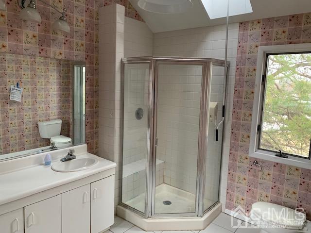 45 Meyer Road Edison, NJ 08817 - Photo 11 of 11 a bathroom with a shower sink and mirror