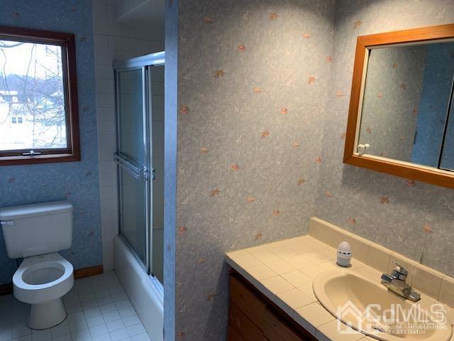 45 Meyer Road Edison, NJ 08817 - Photo 9 of 11 a bathroom with a granite countertop sink toilet and mirror