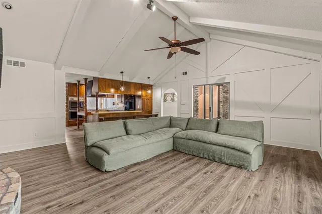 a kitchen with stainless steel appliances a stove a refrigerator and cabinets