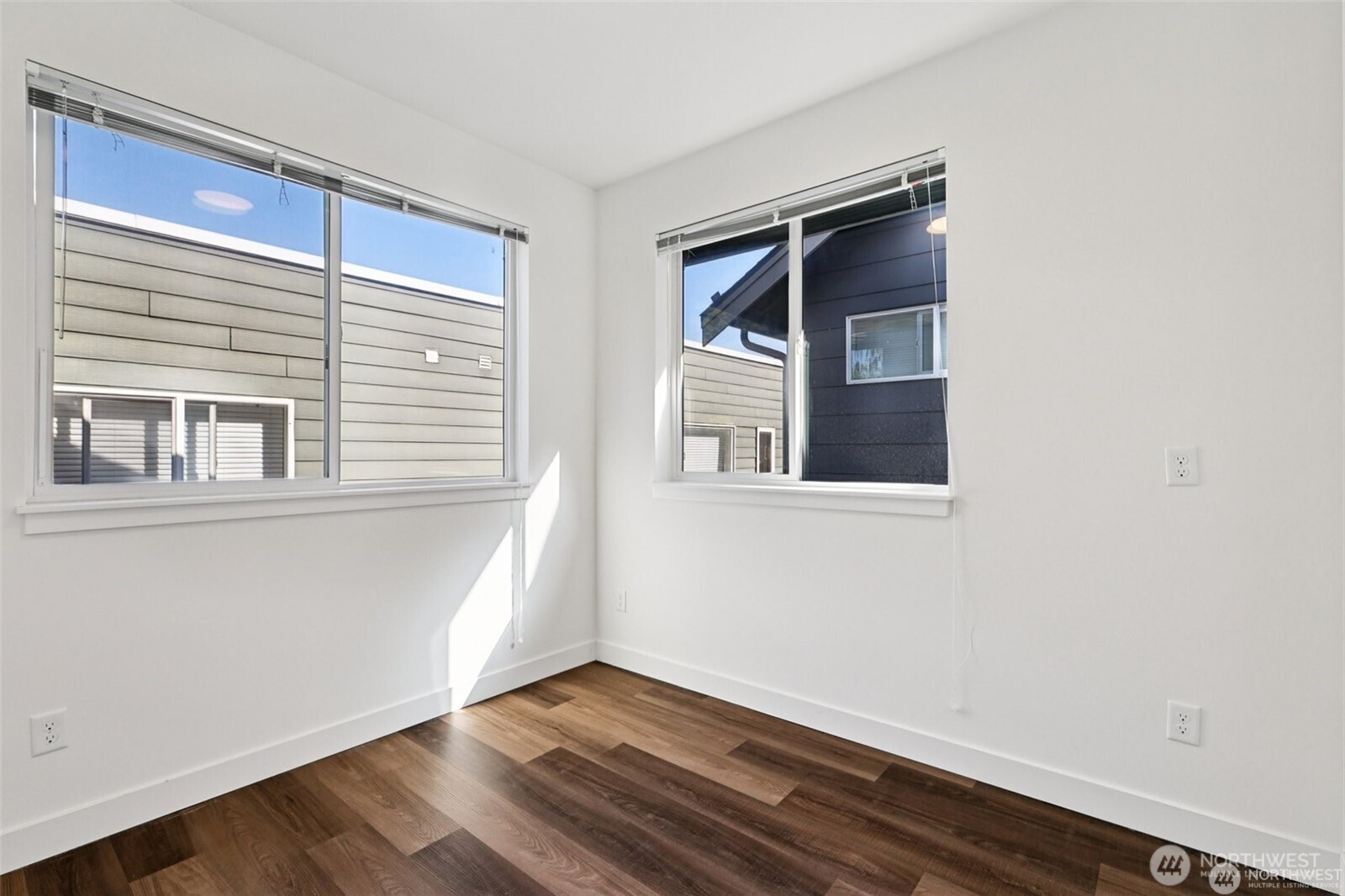 5259 Brooklyn Avenue Northeast Seattle, WA 98105 - Photo 19 of 40 a view of an empty room with wooden floor and a window