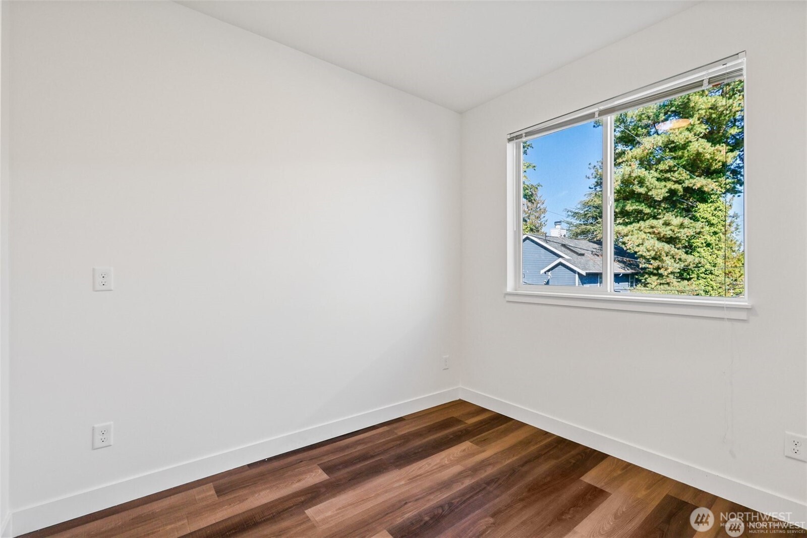 5259 Brooklyn Avenue Northeast Seattle, WA 98105 - Photo 21 of 40 a view of a small space with wooden floor and a window