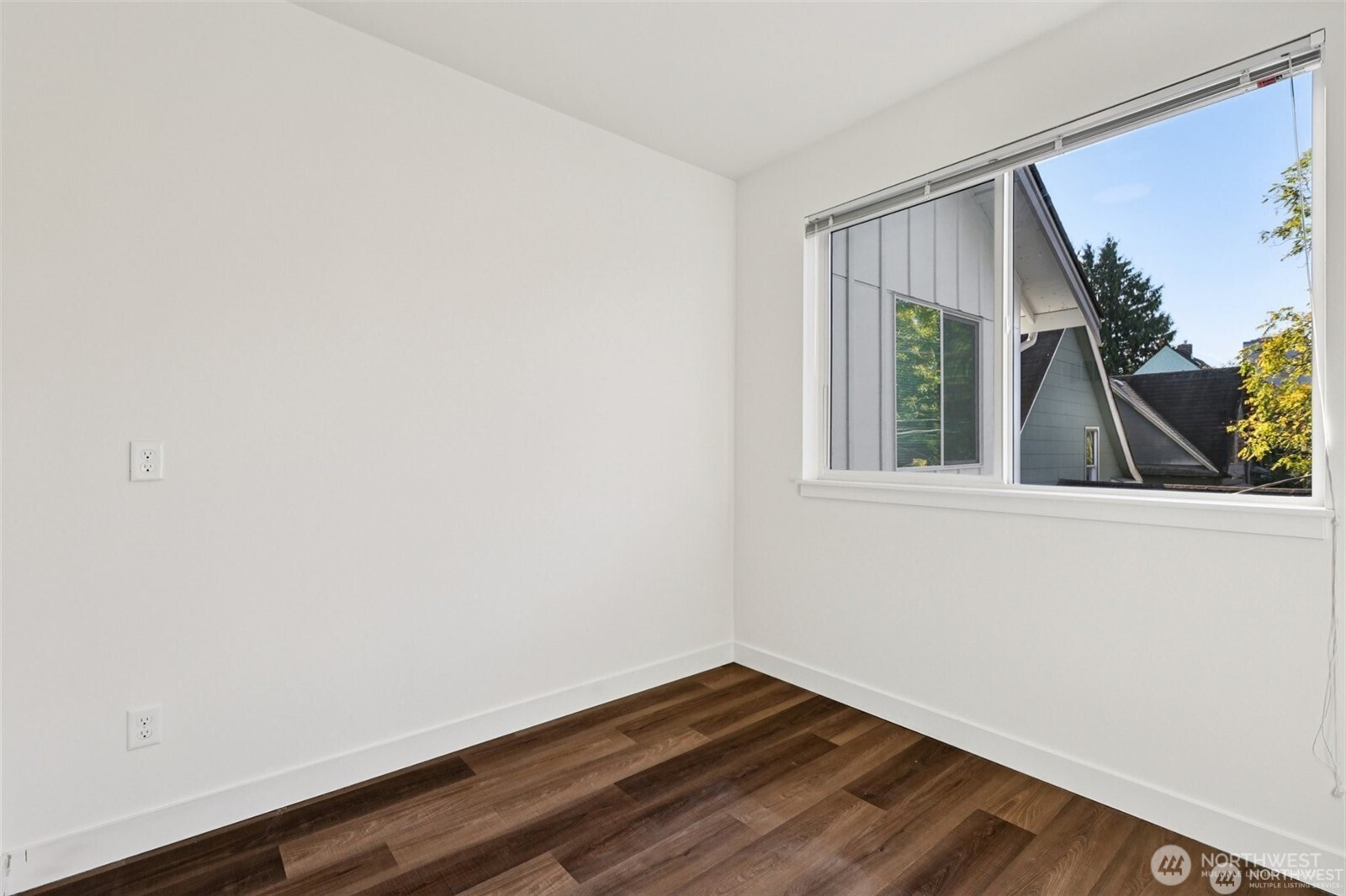 5259 Brooklyn Avenue Northeast Seattle, WA 98105 - Photo 23 of 40 a view of a small space with wooden floor and a window