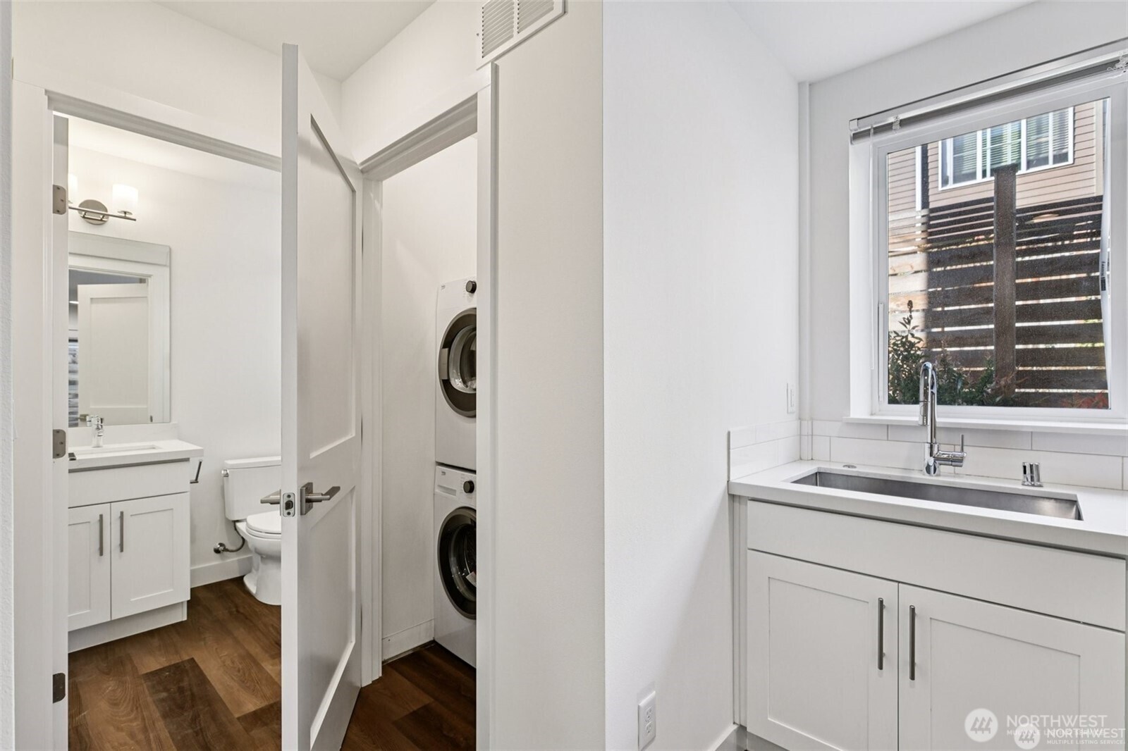 5259 Brooklyn Avenue Northeast Seattle, WA 98105 - Photo 27 of 40 a en suite bathroom with a granite countertop sink and a mirror