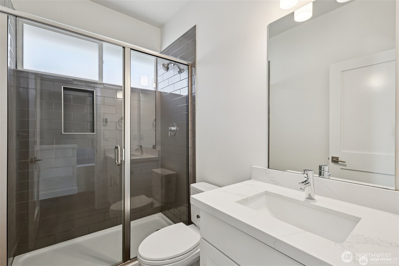 5259 Brooklyn Avenue Northeast Seattle, WA 98105 - Photo 29 of 40 a bathroom with a sink a toilet and shower