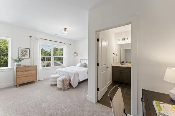 a bed room with furniture and a window