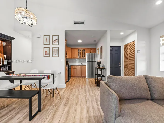 a living room with furniture and a table