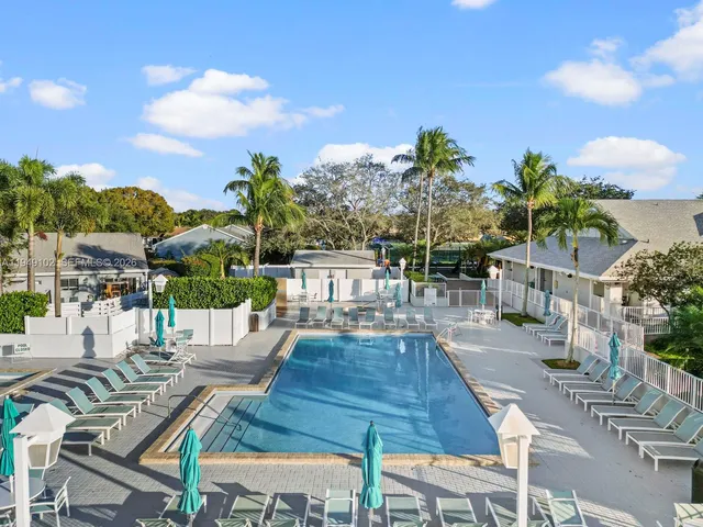 a view of a backyard with sitting area