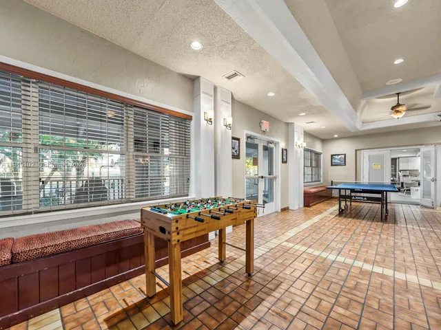 a lobby with furniture and window