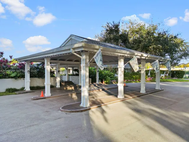 a view of a house with porch and garden