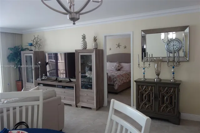 a bed sitting in a bedroom next to a lamp