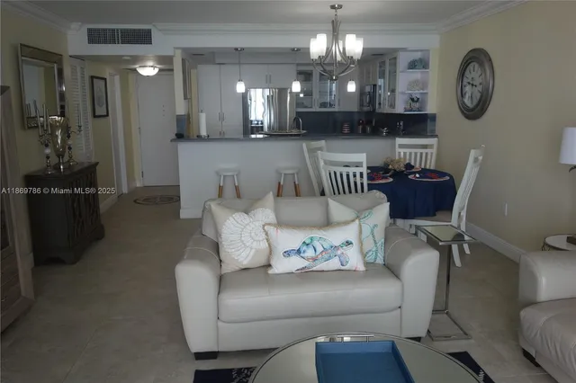 a large bed sitting in a bedroom next to a window