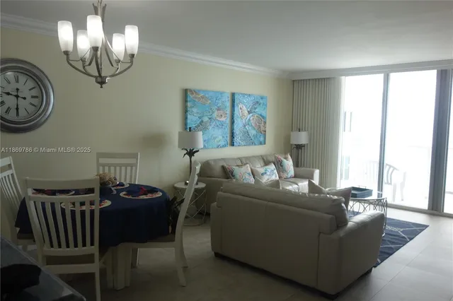 a view of an empty room with hallway and closet area