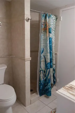 a room with furniture and a potted plant