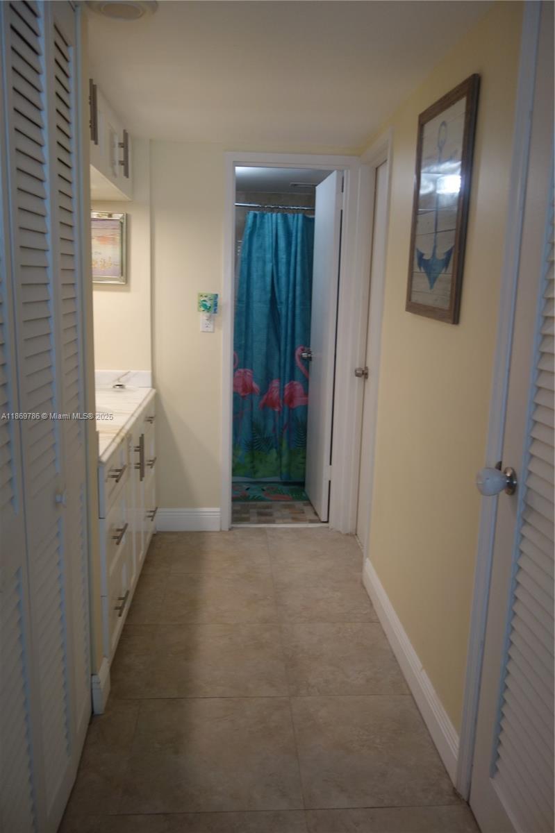 5701 Collins Avenue, Unit 1510 Miami Beach, FL 33140 - Photo 24 of 67 a view of an empty room with hallway and closet area