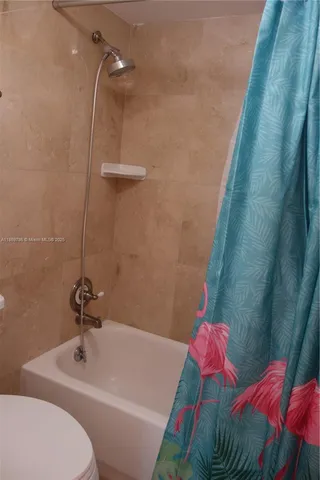 a swimming pool with an outdoor seating and a yard