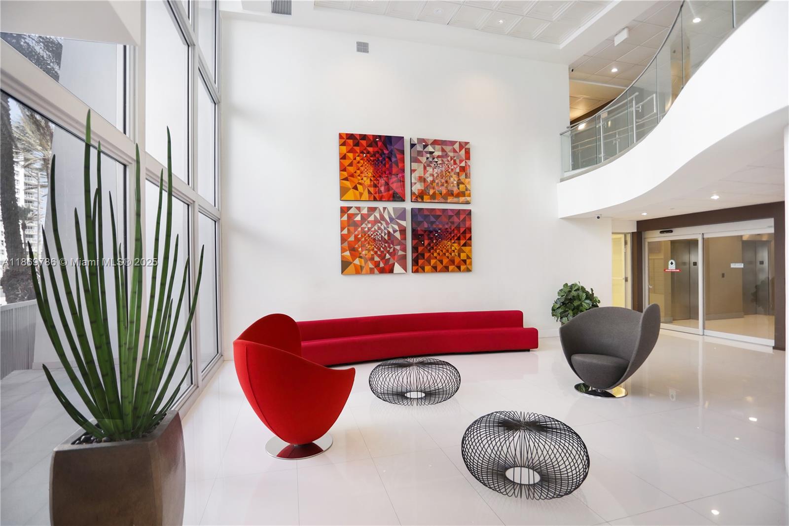 5701 Collins Avenue, Unit 1510 Miami Beach, FL 33140 - Photo 32 of 67 a room with furniture and a potted plant