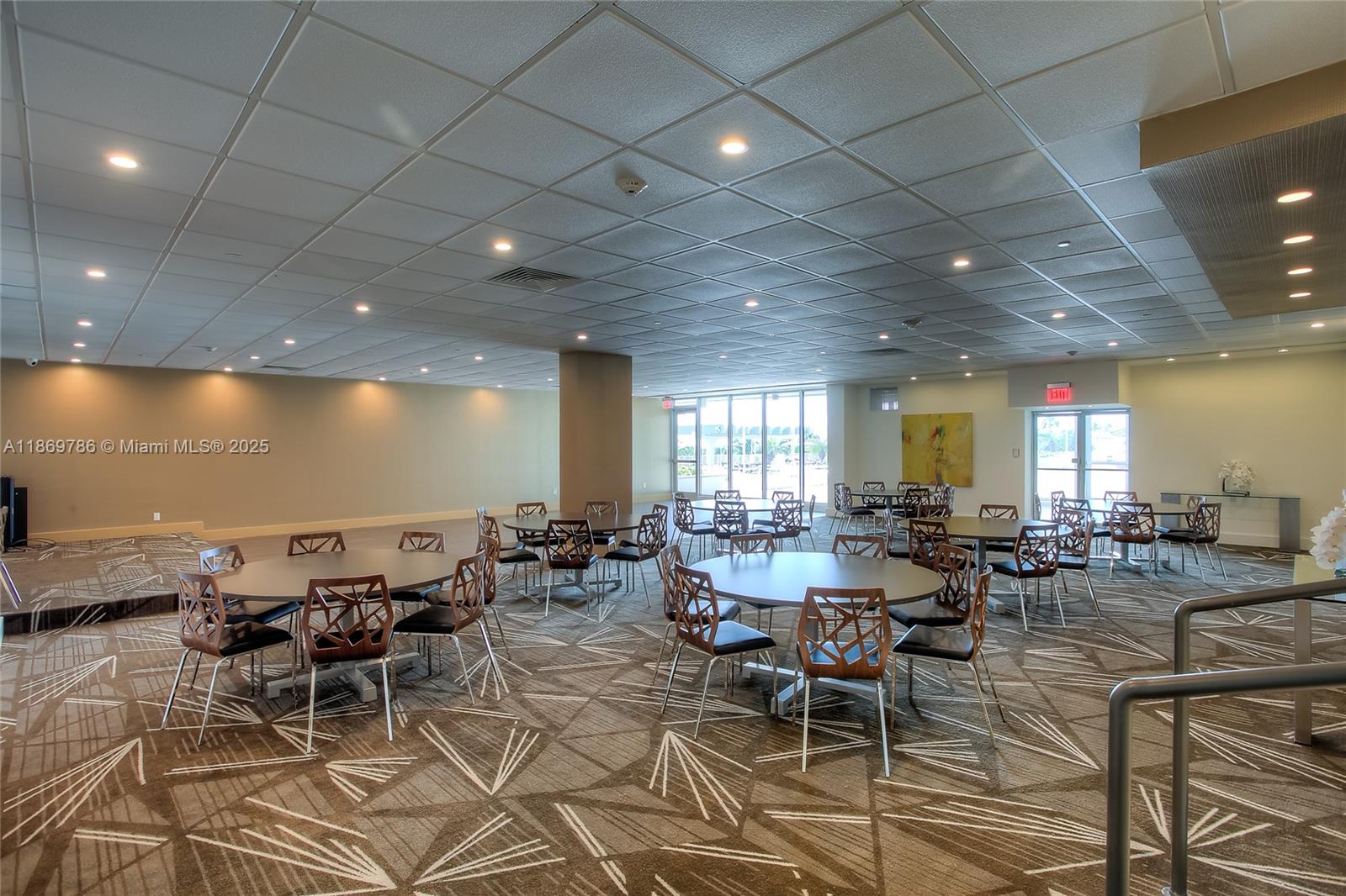 5701 Collins Avenue, Unit 1510 Miami Beach, FL 33140 - Photo 36 of 67 a living room with lots of furniture and a table