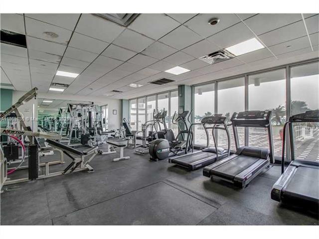 5701 Collins Avenue, Unit 1510 Miami Beach, FL 33140 - Photo 37 of 67 a view of a room with gym equipment