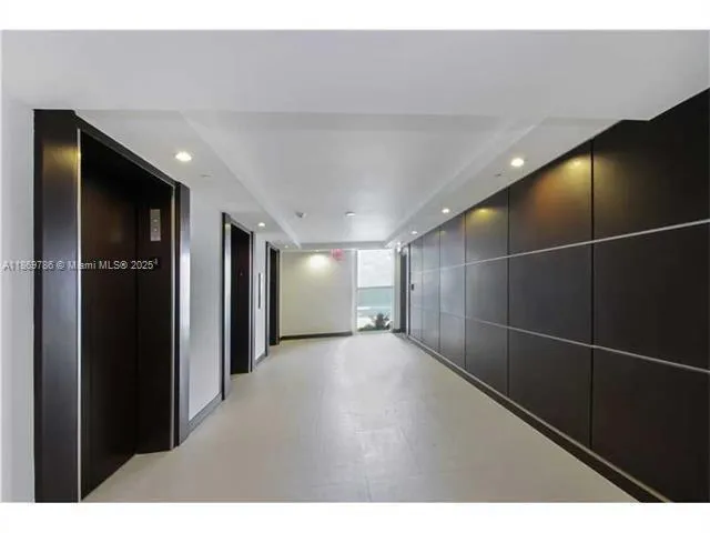 a view of a hallway with dining area