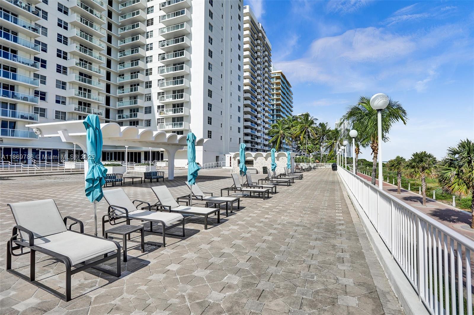5701 Collins Avenue, Unit 1510 Miami Beach, FL 33140 - Photo 47 of 67 a city view with tall buildings and a bench