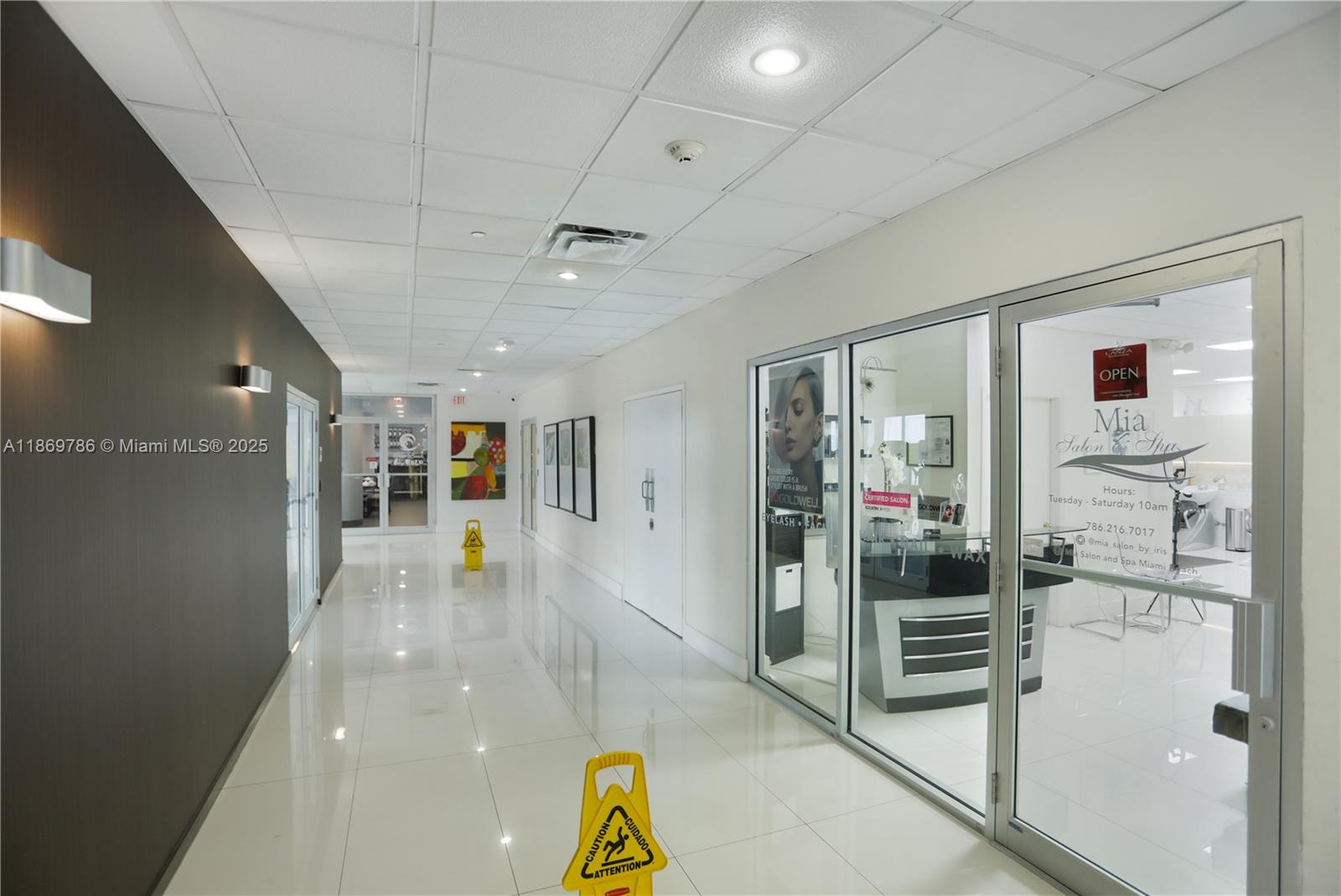 5701 Collins Avenue, Unit 1510 Miami Beach, FL 33140 - Photo 64 of 67 a view of a hallway with dining area
