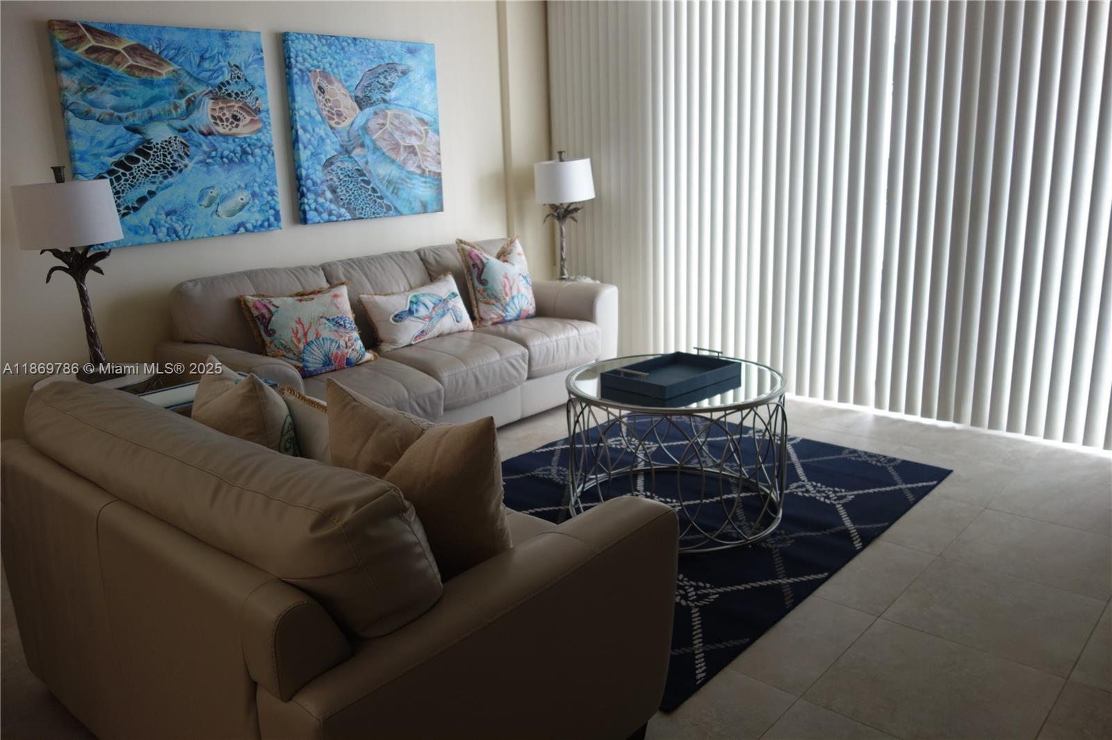 5701 Collins Avenue, Unit 1510 Miami Beach, FL 33140 - Photo 9 of 67 a living room with furniture and a large window