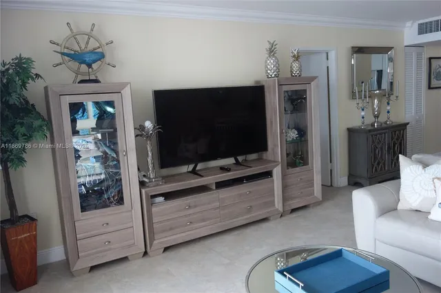 a white bench sitting in front of a house