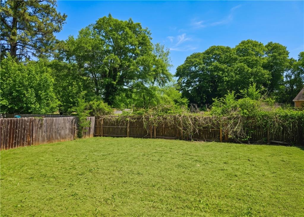 957 Oak Street Southwest Atlanta, GA 30310 - Photo 17 of 17 a swimming pool with a wooden fence