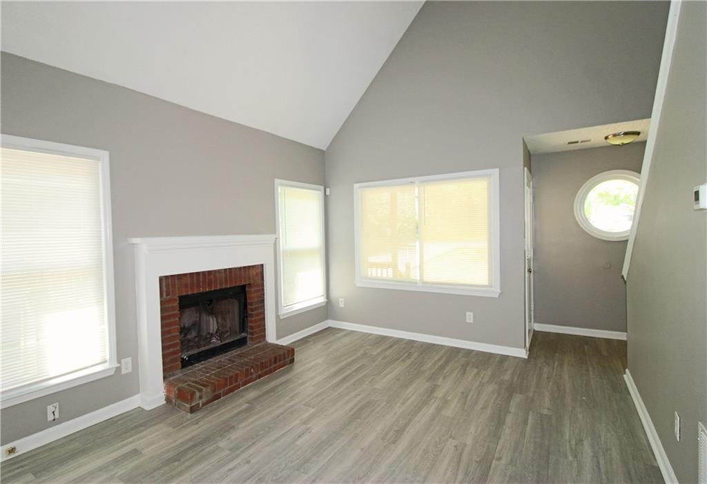 957 Oak Street Southwest Atlanta, GA 30310 - Photo 3 of 17 a view of an empty room with wooden floor and a window