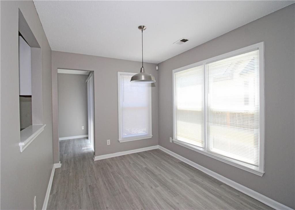 957 Oak Street Southwest Atlanta, GA 30310 - Photo 5 of 17 a view of empty room with wooden floor and fan