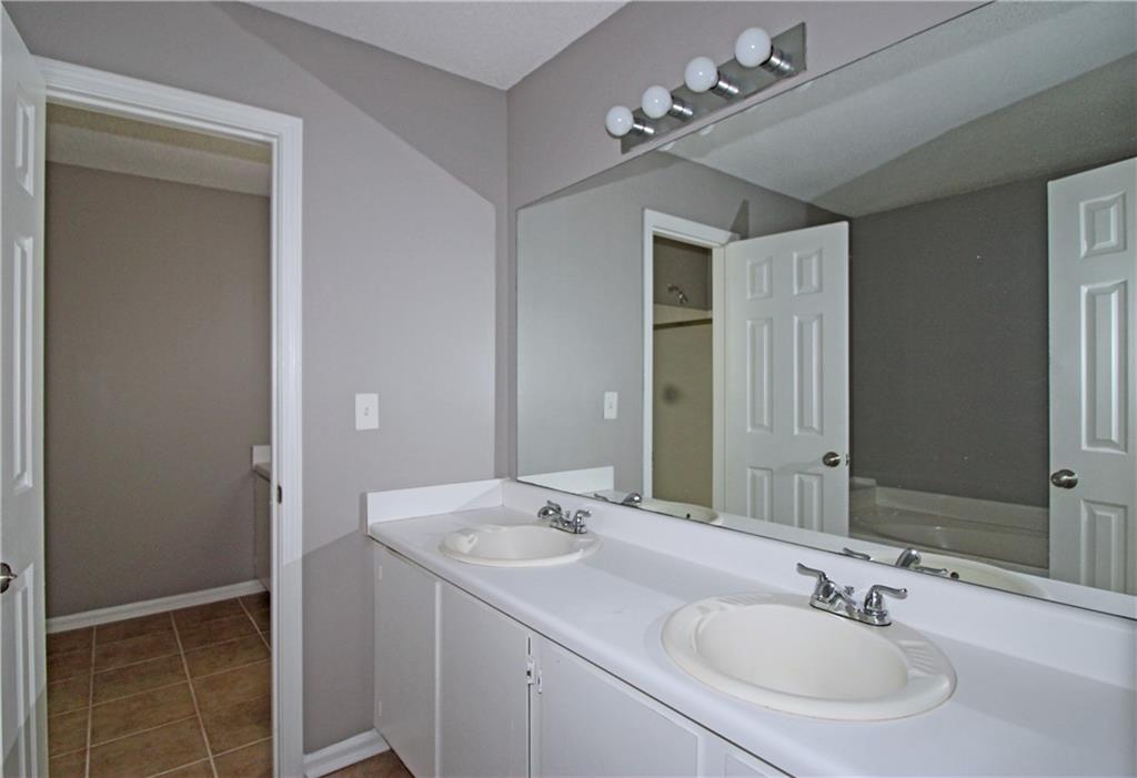 957 Oak Street Southwest Atlanta, GA 30310 - Photo 10 of 17 a bathroom with a sink double vanity and a mirror