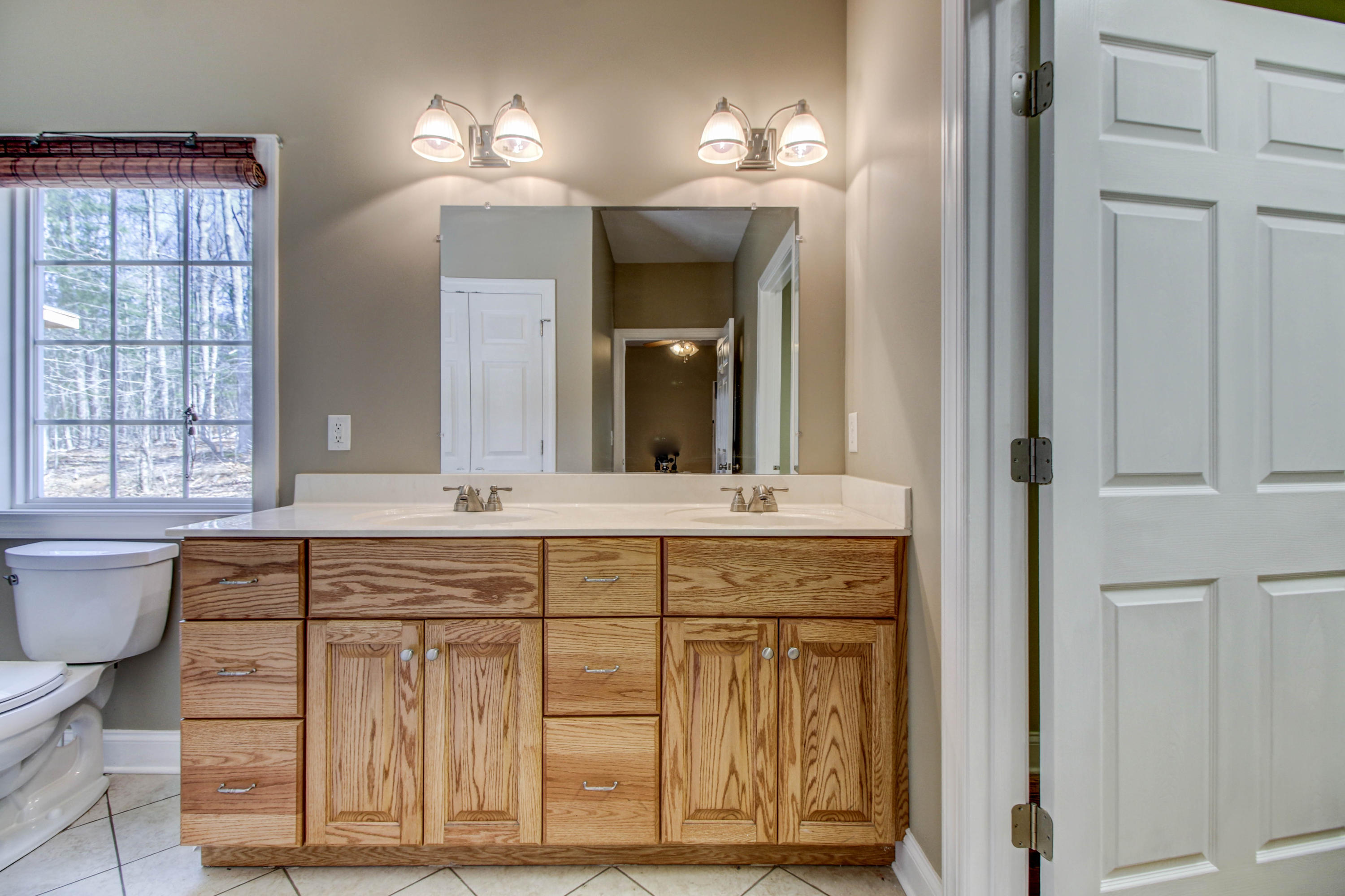796 Hardy Road Hardy, VA 24101 - Photo 22 of 42 a spacious bathroom with a granite countertop sink a toilet and mirror