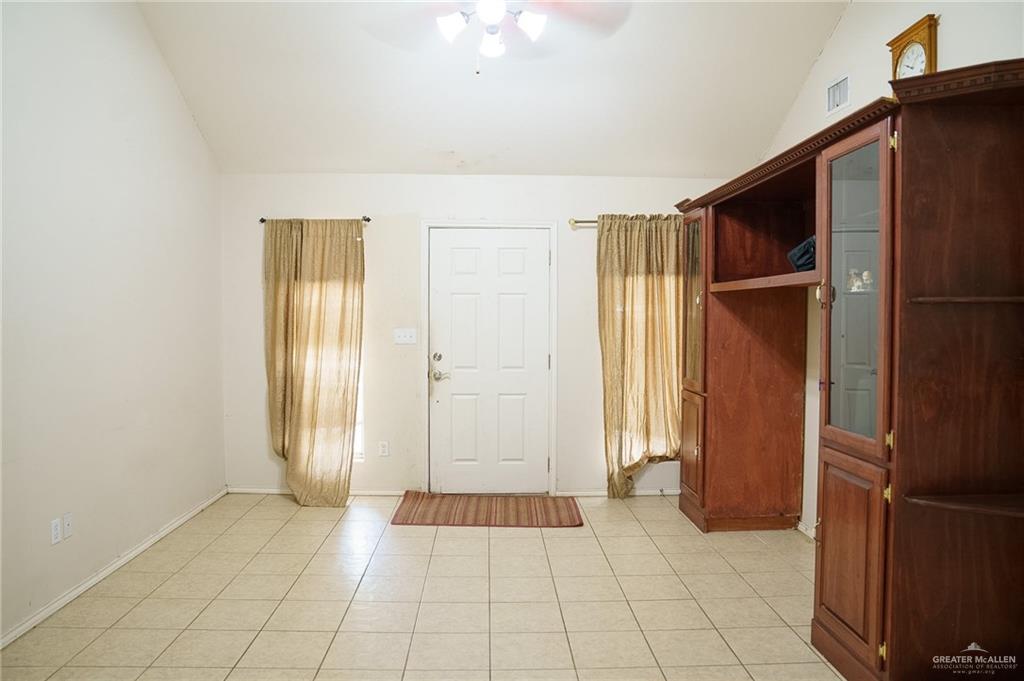 413 31st Street Hidalgo, TX 78557 - Photo 2 of 13 an empty room with windows and closet