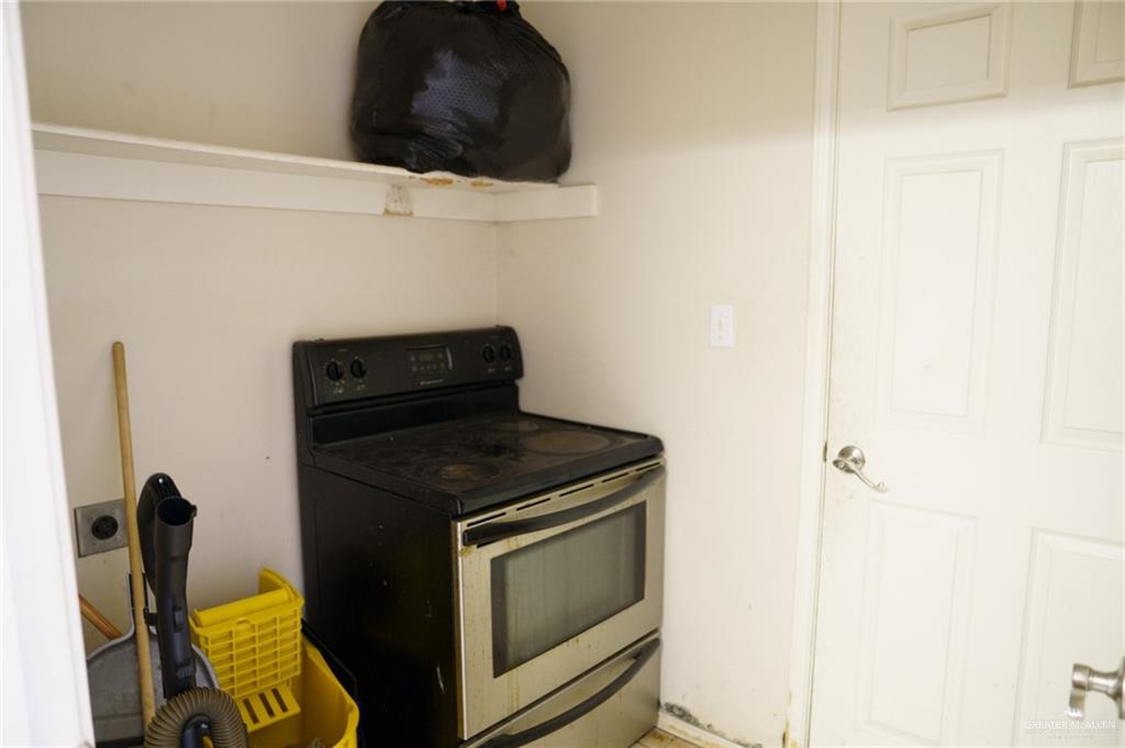 413 31st Street Hidalgo, TX 78557 - Photo 5 of 13 a kitchen with a stove and a microwave