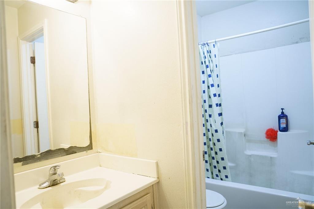 413 31st Street Hidalgo, TX 78557 - Photo 9 of 13 a bathroom with a sink and a mirror