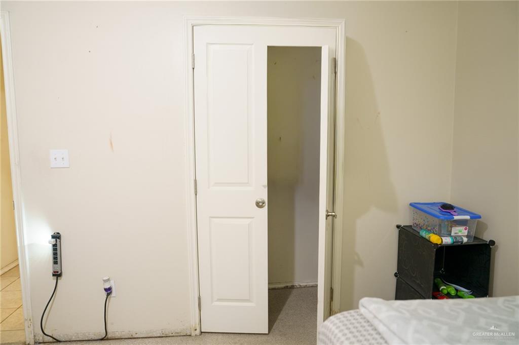 413 31st Street Hidalgo, TX 78557 - Photo 10 of 13 a bedroom with a bed and a mirror