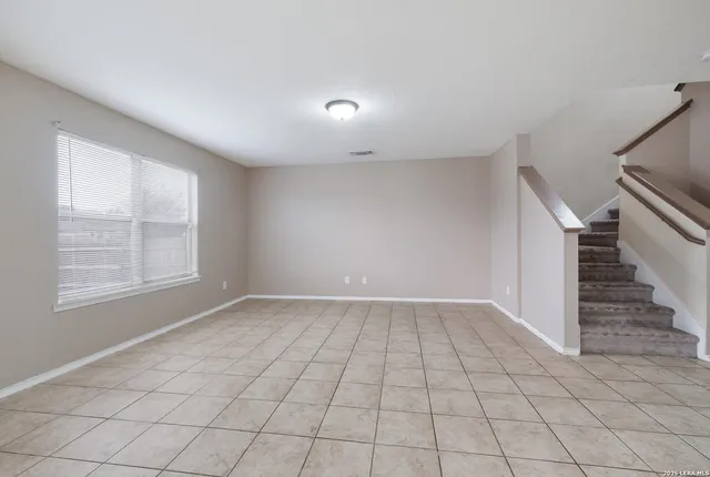 an empty room with windows