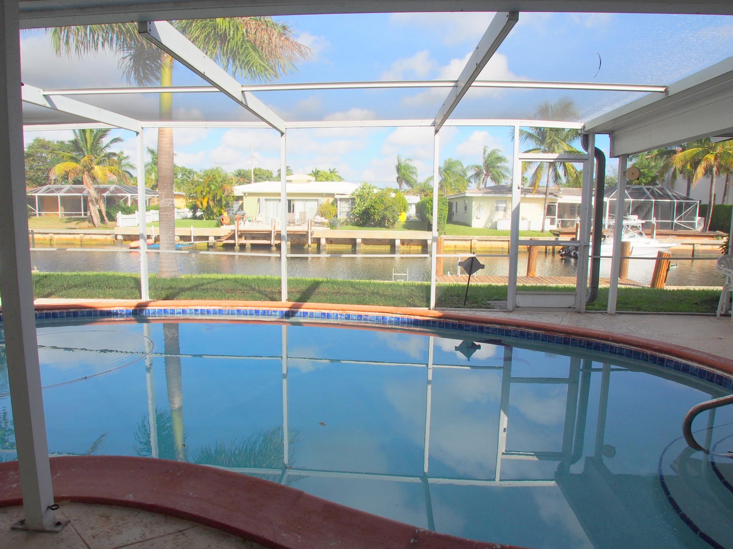 761 Northeast 69th Street Boca Raton, FL 33487 - Photo 33 of 44 Patio and Pool with Waterfront View