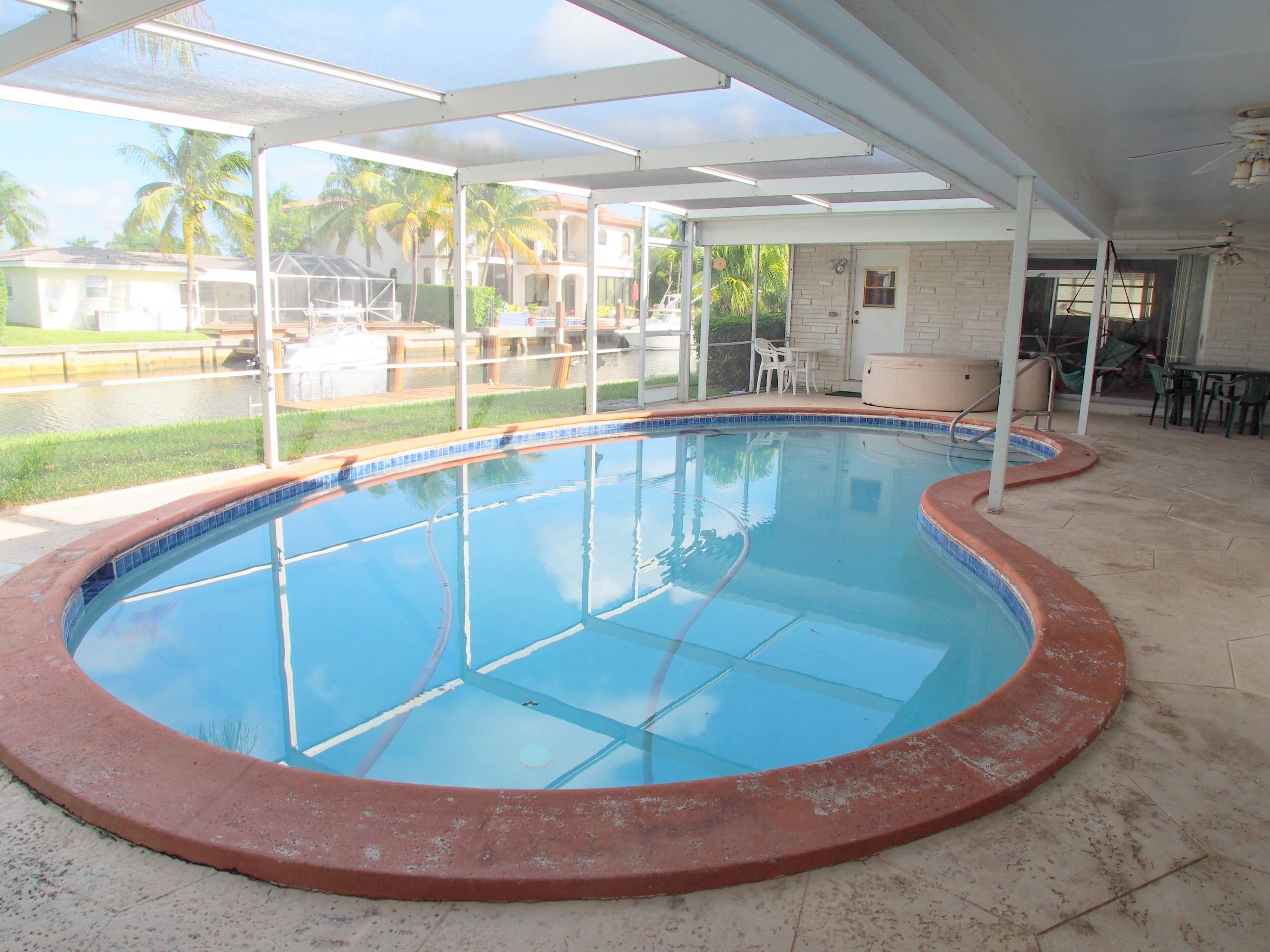 761 Northeast 69th Street Boca Raton, FL 33487 - Photo 36 of 44 Pool and Screened In Patio