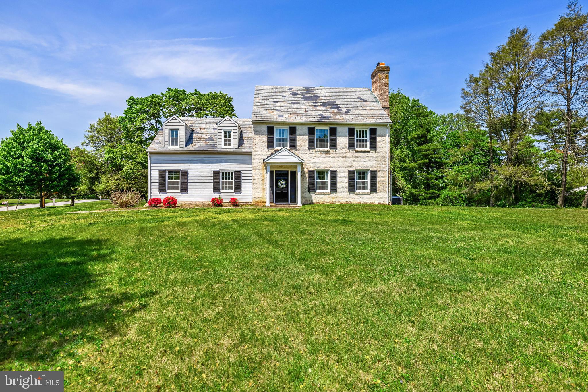 2430 Stanwick Road Phoenix, MD 21131 - Photo 1 of 51 a front view of a house with a garden