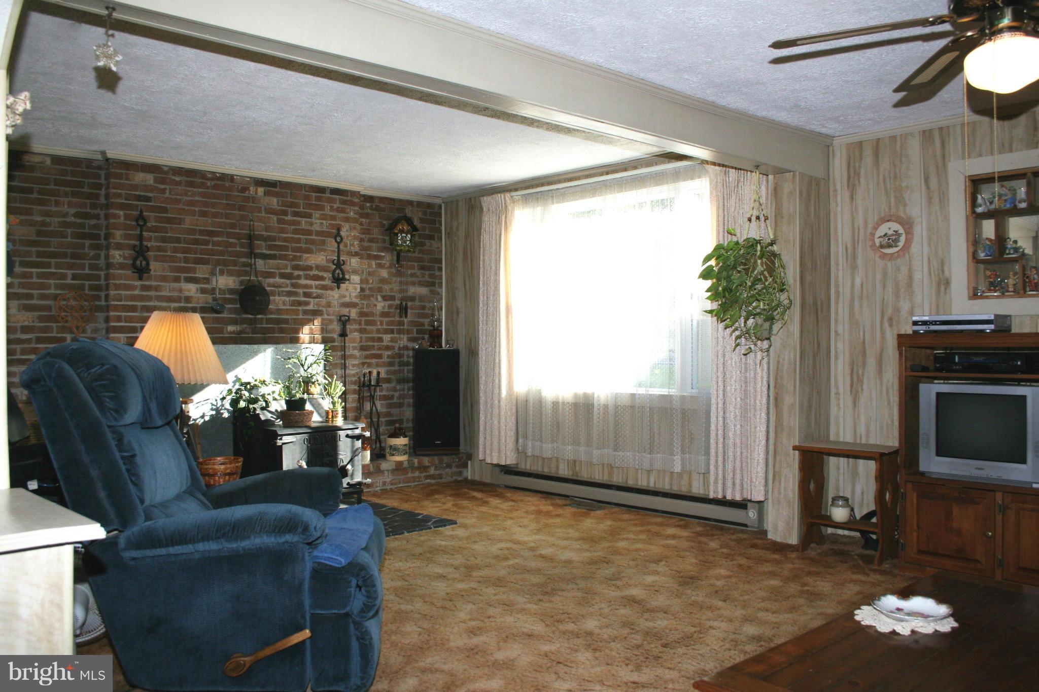 18900 Fuller Heights Road Triangle, VA 22172 - Photo 8 of 23 Living Room has wood stove