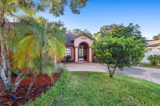 a bathroom with a granite countertop sink mirror and toilet