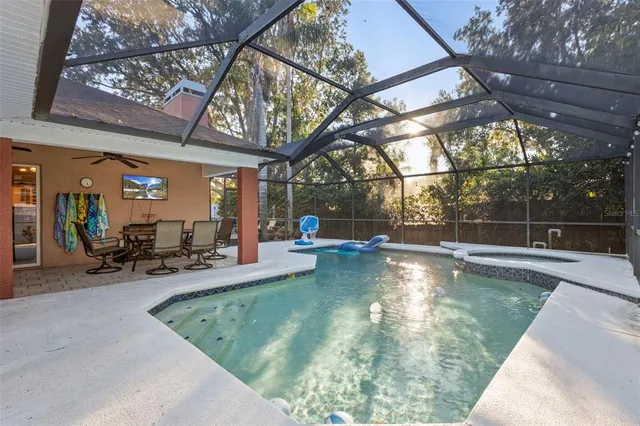 a view of a swimming pool with sitting area