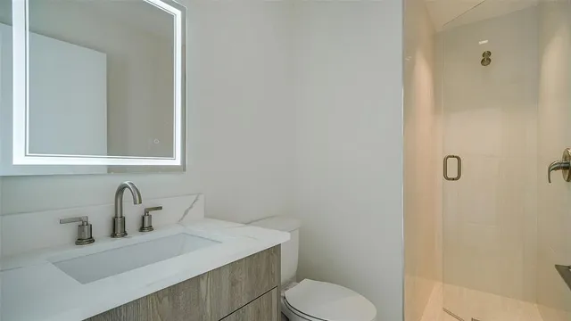 a view of a car park in front of house